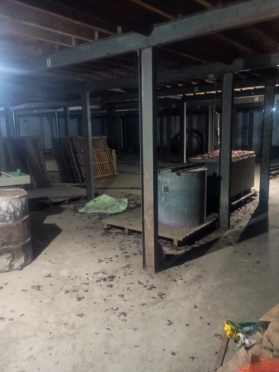 Numbered steel rack frames inside cold storage facility